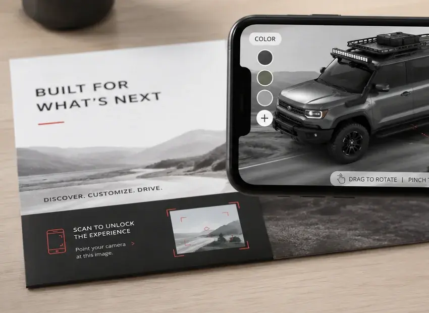 Close-up of a printed direct-mail piece reading Built for what's next, with an EyeLoup scan panel that says Scan to unlock the experience.